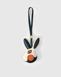 RABBIT CHARM charm handmade from French Alran genuine goatskin — A rabbit head in black and cream. One ear dark navy, one. Three days by hand. Arrives in luxury gift packaging. Designed in Amsterdam.