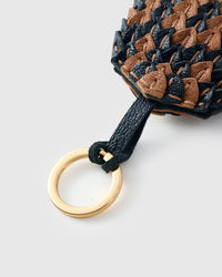 Black-and-caramel scaled charm on an 18K gold-plated keychain clip — clips to keys, bags or backpacks.