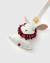 Both editions of the rabbit charm — leather strap loop for bags, or 18K gold-plated keychain clip.