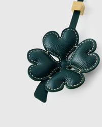Close-up of STICKYZOO Lucky Clover Charm — full-grain French Alran goatskin from Tarn, France. Padded heart-shaped petals with contrast stitching. 3-day handmade piece.