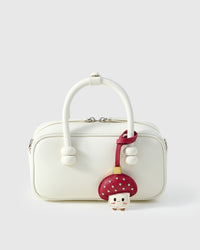 STICKYZOO Mushroom Charm — hand-layered French Alran goatskin, mushroom cap with cream face. Designed in Amsterdam.