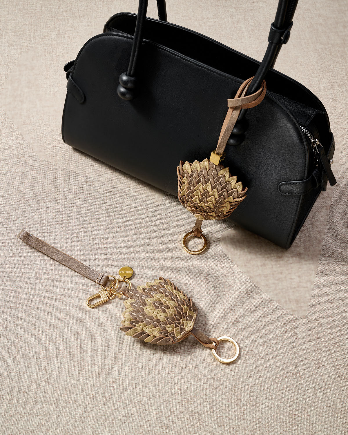 Scaled charm — finished one at a time, by hand.