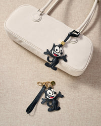 Cartoon Cat charm — genuine French Alran goatskin. Never vegan. Never synthetic. The difference shows.
