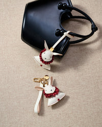 RABBIT CHARM on an 18K gold-plated keychain clip with engraved STICKYZOO disc — clips to keys, bags or backpacks.