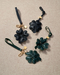 STICKYZOO Lucky Clover Charm — dual attachment option: leather strap for bags or keychain clip. French Alran goatskin.