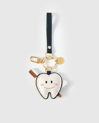 Tooth fairy charm on a bag, side angle — rated 4.9★ by thousands of buyers. Real French Alran leather, 3 days by hand.