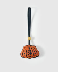PUMPKIN charm handmade from French Alran goatskin and French suede — real full-grain French leather from Tarn, since 1903. Three days of hand-cutting, hand-stitching, hand-layering. Arrives in luxury gift packaging. Designed in Amsterdam.