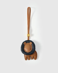 LION CHARM charm handmade from French Alran genuine goatskin — A lion from behind. You see the dark navy mane first — a. Three days by hand. Arrives in luxury gift packaging. Designed in Amsterdam.