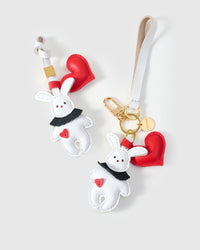 Both editions of the rabbit charm — leather strap loop for bags, or 18K gold-plated keychain clip.