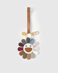 Close-up of STICKYZOO Night Flower Charm — full-grain French Alran goatskin from Tarn, France. Multi-colour petals with smiley face. 3-day handmade piece.