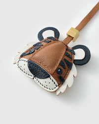 TIGER CHARM on an 18K gold-plated keychain clip with engraved STICKYZOO disc — clips to keys, bags or backpacks.