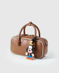 Goofy charm — every detail stitched into the real French Alran goatskin face by hand.