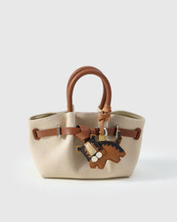 TIGER TIKO CHARM charm styled on a bag — a small, specific piece that turns a simple bag into a personal one.