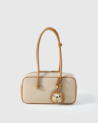 HEDGEHOG CHARM charm styled on a bag — a small, specific piece that turns a simple bag into a personal one.