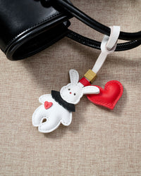 RABBIT CHARM charm styled on a bag — a small, specific piece that turns a simple bag into a personal one.