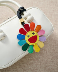 STICKYZOO Night Flower Charm — hand-cut, hand-stitched multi-colour petals with smiley face in French Alran goatskin. Designed in Amsterdam.