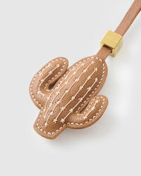 STICKYZOO Cactus Charm — hand-layered French Alran goatskin, saguaro silhouette with cream cross-stitch. Designed in Amsterdam.