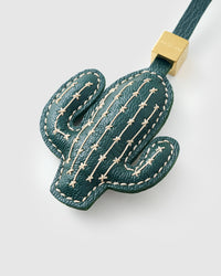 STICKYZOO Cactus Charm clipped to a handbag — handmade French Alran goatskin in forest green. 3-day artisan build.