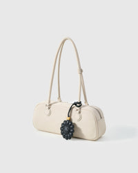 STICKYZOO Night Flower Charm with engraved gold hardware cube — handmade French Alran goatskin, all-black.