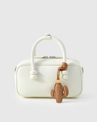 STICKYZOO Cactus Charm — hand-cut, hand-stitched saguaro silhouette with cream cross-stitch in French Alran goatskin. Designed in Amsterdam.