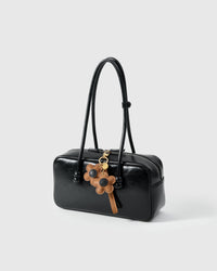 STICKYZOO Twin Flowers Charm — hand-layered French Alran goatskin, twin five-petal blooms on gold keychain. Designed in Amsterdam.