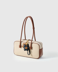 STICKYZOO Twin Flowers Charm — hand-layered French Alran goatskin, twin five-petal blooms on gold keychain. Designed in Amsterdam.