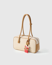 Both editions of the Teddy Bear Gift — leather strap loop for bags, or 18K gold-plated keychain clip.