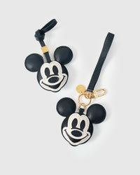 Both editions of the Mickey charm — leather strap loop for bags, or 18K gold-plated keychain clip.