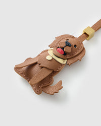 Handmade Golden Retriever leather bag charm with 18K gold-plated keychain clip and engraved STICKYZOO gold tag — for keys, bags, and backpacks. French Alran goatskin.