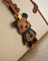 VIOLENT BEAR CHARM charm styled on a bag — a small, specific piece that turns a simple bag into a personal one.