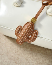 STICKYZOO Cactus Charm in warm tan French Alran goatskin. Hand-cut, hand-stitched. Designed in Amsterdam.