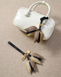 Close-up of STICKYZOO Tulip Charm — full-grain French Alran goatskin from Tarn, France. 3d dimensional tulip with overlapping petals. 3-day handmade piece.