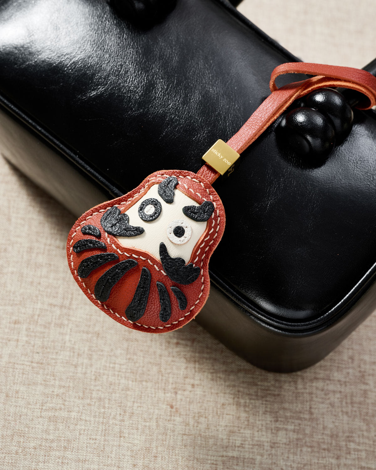 Daruma Leather Bag Charm & Keychain – Handmade in Red & Black