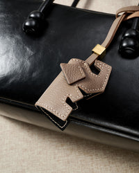 ELEPHANT CHARM charm styled on a bag — a small, specific piece that turns a simple bag into a personal one.