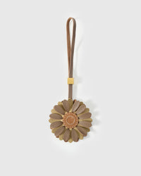 STICKYZOO Daisy Charm — taupe and olive French Alran goatskin petals layered around a warm tan centre disc with hand-stitched seed marks. 3-day handmade piece.
