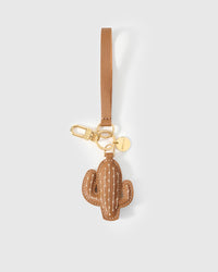 STICKYZOO Cactus Charm clipped to a handbag — handmade French Alran goatskin in warm tan. 3-day artisan build.