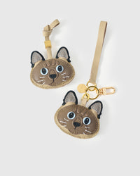 Both editions of the Tonkinese side by side — leather strap loop for bags, or 18K gold-plated keychain clip.