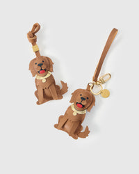 Golden Retriever leather bag charm shown in both attachment options — handmade French Alran goatskin, dual attachment. STICKYZOO Amsterdam design.