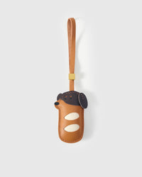 Handmade Dachshund Sausage Pup leather bag charm by STICKYZOO — French Alran goatskin, hand-cut and hand-stitched by one artisan over 5 days. Designed in Amsterdam.