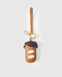 Handmade Dachshund Sausage Pup leather bag charm with 18K gold-plated keychain clip and engraved STICKYZOO gold tag — for keys, bags, and backpacks. French Alran goatskin.
