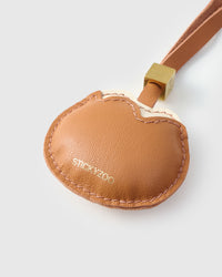 Bread Kitty on a bag, side angle — loved by thousands of cat people. Real French leather, 3 days by hand.