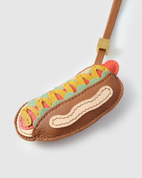 Wear the hot dog charm on a bag with the leather strap loop, or clip it to keys with the 18K gold-plated keychain clip.