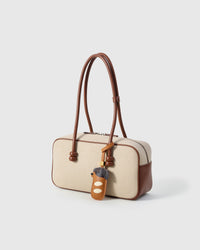 Handmade Dachshund Sausage Pup leather bag charm — French Alran goatskin from a tannery founded in 1903 in Tarn, France. STICKYZOO Amsterdam design.