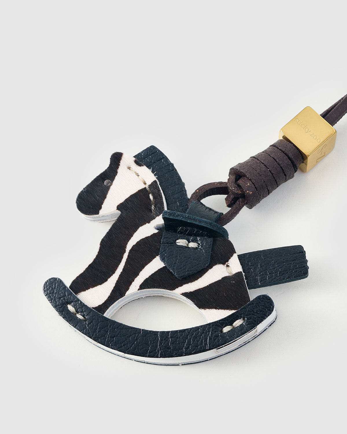 ZEBRA RIDE STACK CHARM