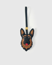 Handmade German Shepherd leather bag charm by STICKYZOO — French Alran genuine goatskin, hand-cut and hand-stitched by one artisan over 5 days. Collectible series. Designed in Amsterdam.