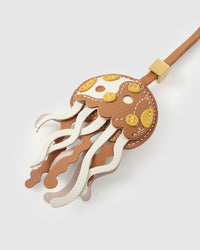 Jellyfish charm on a bag, side angle — rated 4.9★ by thousands of buyers. Real French Alran leather, 3 days by hand.