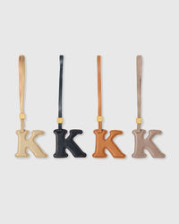 K initial charm handmade from French Alran genuine goatskin leather. Three days of hand-cutting, layering and stitching. A thoughtful gift for names starting with K — Kate, Kai, Kira, Kieran, Kimberly. Arrives in luxury gift packaging. Designed in Amsterdam.