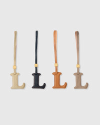 L initial charm handmade from French Alran genuine goatskin leather. Three days of hand-cutting, layering and stitching. A thoughtful gift for names starting with L — Luca, Lily, Louis, Layla, Leo. Arrives in luxury gift packaging. Designed in Amsterdam.