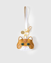 The ginger British Shorthair on an 18K gold-plated keychain clip with engraved STICKYZOO disc — clip it to keys, bags, or backpacks.