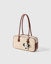 Handmade Dalmatian Luxe leather bag charm with 18K gold-plated cube hardware engraved with STICKYZOO — French Alran goatskin, 7-day artisan build.
